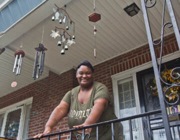 Felicia Ashley on her porch in the East Germantown section of Philadelphia. (Kimberly Paynter/WHYY)