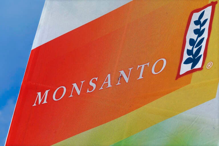 This Aug. 31, 2015 file photo shows the Monsanto logo on display at the Farm Progress Show in Decatur, Ill. (AP Photo/Seth Perlman, File)