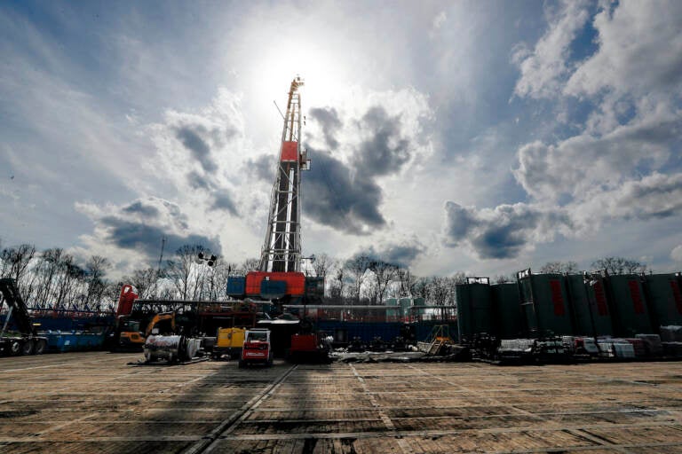 In this March 12, 2020, file photo, the sun shines through clouds above a shale gas drilling site in St. Mary's, Pa. (AP Photo/Keith Srakocic, File)