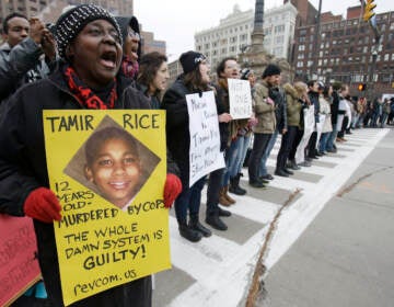 In this Nov. 25, 2014 file photo, demonstrators block Public Square in Cleveland, during a protest over the police shooting of 12-year-old Tamir Rice. (AP Photo/Tony Dejak, File)