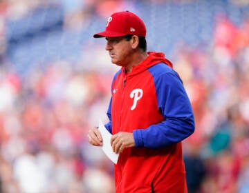 Philadelphia Phillies interim manager Rob Thomson walks to exchange line ups before a baseball game against the Los Angeles Angels, Friday, June 3, 2022, in Philadelphia. (AP Photo/Matt Slocum)