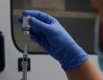 File photo: A vial of the Phase 3 Novavax coronavirus vaccine is seen ready for use in the trial at St. George's University hospital in London, Oct. 7, 2020. (AP Photo/Alastair Grant, File)