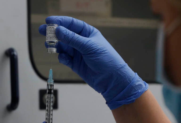 File photo: A vial of the Phase 3 Novavax coronavirus vaccine is seen ready for use in the trial at St. George's University hospital in London, Oct. 7, 2020. (AP Photo/Alastair Grant, File)