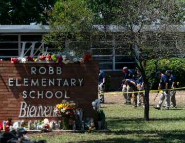 File photo: Investigators search for evidences outside Robb Elementary School in Uvalde, Texas, May 25, 2022, after an 18-year-old gunman killed 19 students and two teachers. (AP Photo/Jae C. Hong, File)