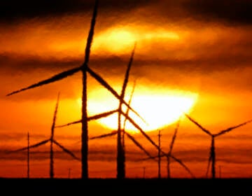 File photo: Wind turbines are silhouetted against the rising sun Wednesday, Jan. 13, 2021, near Spearville, Kan. (AP Photo/Charlie Riedel, File)