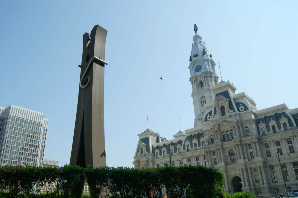 A view of the Clothespin statue on a sunny day shows City Hall in the background.