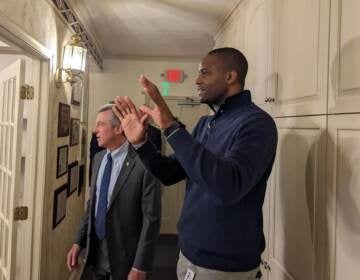 Eugene Young (right) of the Delaware State Housing Authority tours a home with Gov. John Carney. (State of Delaware)