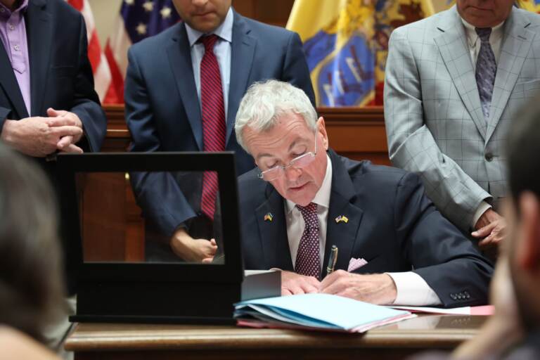 N.J. Gov. Phil Murphy signs a new package of state gun control laws at a press conference in Metuchen, New Jersey on July 5, 2022. (@GovMurphy/Twitter)