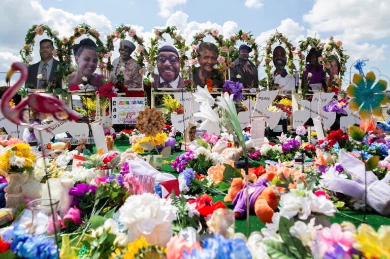 The white gunman who killed 10 Black people and injured three other individuals at a Tops supermarket in Buffalo, N.Y., in May was indicted by a federal grand jury on Thursday on hate crimes and firearm charges. Here, a memorial for the supermarket shooting victims is set up outside Tops on July 14. (Joshua Bessex/AP)