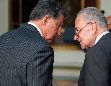 Sen. Joe Manchin, D-W.Va., talks with Senate Majority Leader Chuck Schumer of N.Y., on March 15, 2022. (Patrick Semansky/AP)