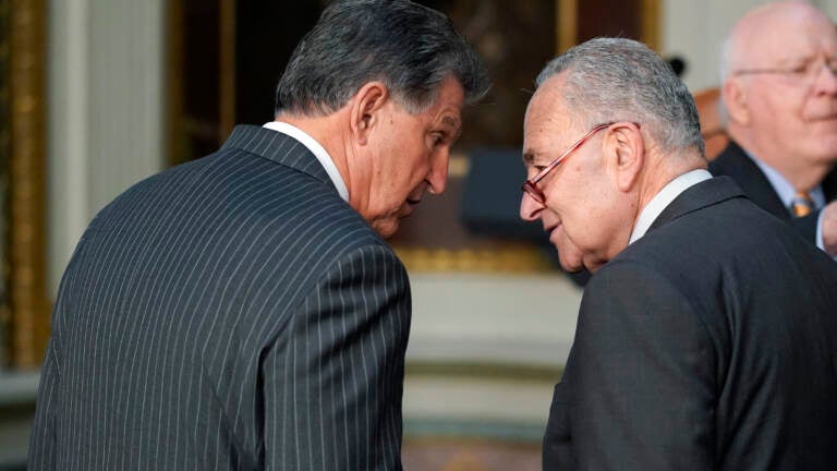 Sen. Joe Manchin, D-W.Va., talks with Senate Majority Leader Chuck Schumer of N.Y., on March 15, 2022. (Patrick Semansky/AP)