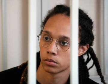 WNBA star and two-time Olympic gold medalist Brittney Griner sits in a cage at a court room prior to a hearing, in Khimki just outside Moscow, Russia, Wednesday, July 27, 2022. (AP Photo/Alexander Zemlianichenko, Pool)
