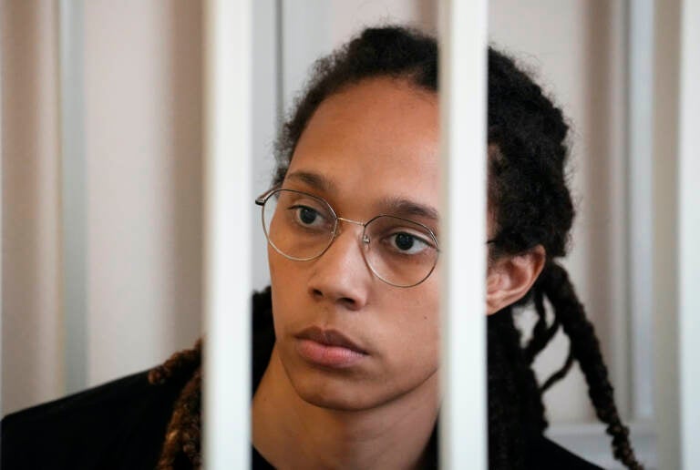 WNBA star and two-time Olympic gold medalist Brittney Griner sits in a cage at a court room prior to a hearing, in Khimki just outside Moscow, Russia, Wednesday, July 27, 2022. (AP Photo/Alexander Zemlianichenko, Pool)