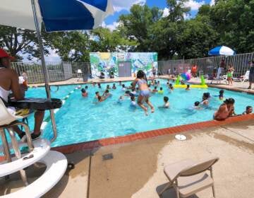 The pool was packed on opening day at North Camden Community Center, July 14, 2022. (Tom MacDonald / WHYY)