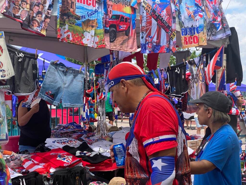 An attendee of Concilio's Hispanic Fiesta at Penn's Landing on July 10, 2022 looks at items for sale from one of the vendors.