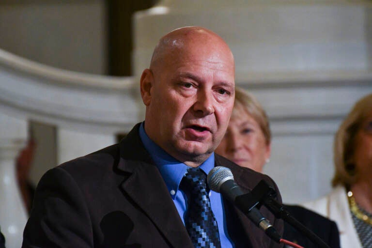 Doug Mastriano speaks from a podium