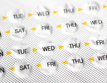 A view of birth control pills in a packet, marked by days of the week