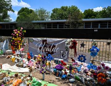 Mementos decorate a makeshift memorial to the victims of the mass shooting at Robb Elementary School in Uvalde, Texas. To protect students from active shooters and extreme weather, National Safety Shelters sells safety pods that can fit a classroom of students inside. (Chandan Khanna/AFP via Getty Images)