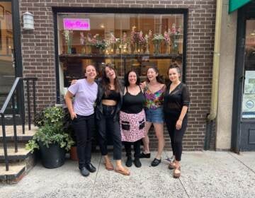 Women gather in front of the restaurant, Her Place Supper Club.