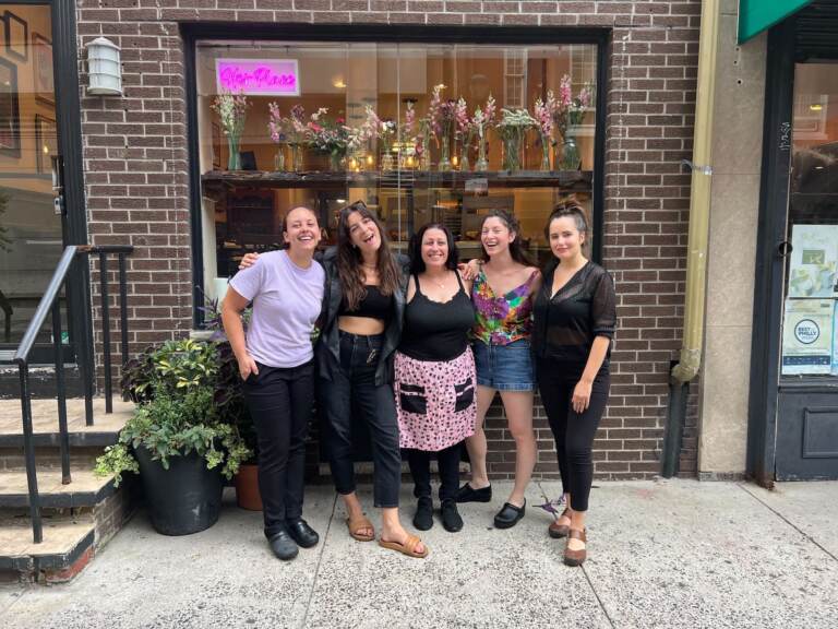 Women gather in front of the restaurant, Her Place Supper Club.