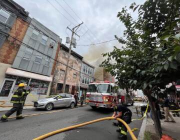 Firefighters putting out a fire that broke out at Jim's Steaks on South St. July 29, 2022.