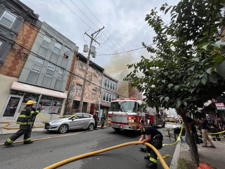 Firefighters putting out a fire that broke out at Jim's Steaks on South St. July 29, 2022.