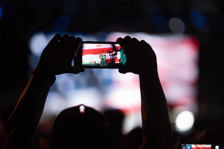 A performer is seen on the phone screen of a spectator of Philly's Wawa Welcome America July 4th concert