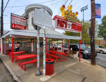 The exterior of Pat's King of Steaks is visible.