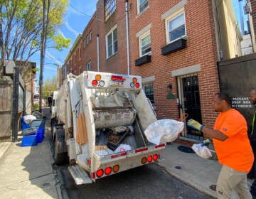 Streets Department workers pick up residents' trash