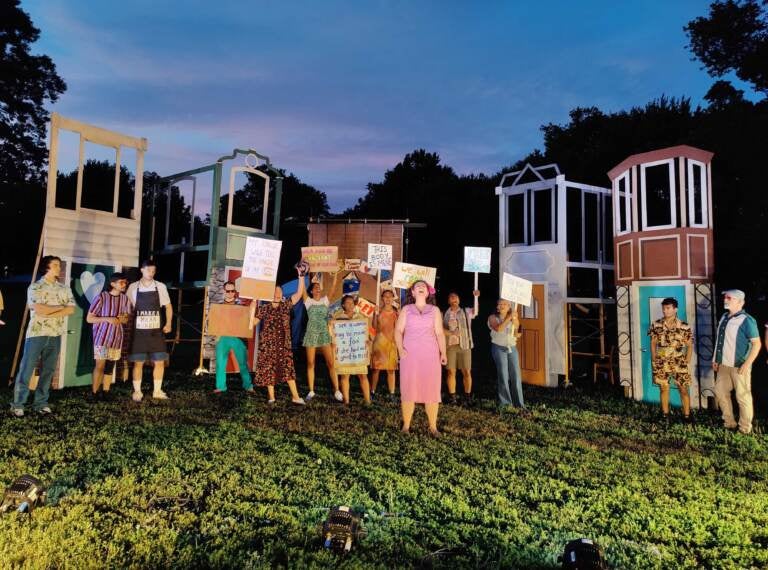 Minou Pourshariati as Bianca leads the Actively Conscious Chorus through a protest song in 'The Tamer Tamed,' opening the second act of Shakespeare in Clark Park’s production of 'The Taming!' set in West Philly circa 1990s. (Peter Crimmins / WHYY)