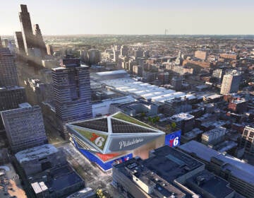 An aerial view with a rendering of what the new arena would look like, amid existing buildings in Philadelphia's downtown.