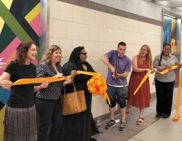 Ribbon-cutting for the art installation at Suburban Station on July 12, 2022. (Tom MacDonald/WHYY)