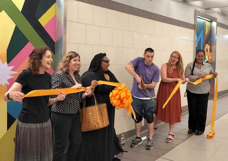 Ribbon-cutting for the art installation at Suburban Station on July 12, 2022. (Tom MacDonald/WHYY)