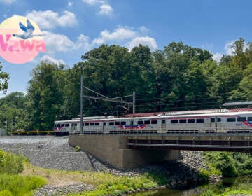 A SEPTA train is visible and a Wawa logo sits in the upper left hand corner of the photo.