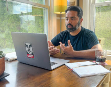 Nitin Budhiraja is seen facing his computer during a Zoom meeting
