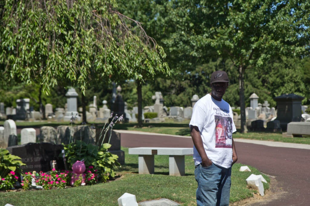 Lionel Dotson stands at Ivy Hill Cemetery