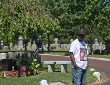 Lionel Dotson stands at Ivy Hill Cemetery