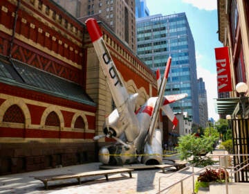 ''Grumman Greenhouse'' has occupied Lenfest Plaza at the Pennsylvania Academy of Fine Arts since 2011. The sculpture features a Navy war plane that has been converted into a greenhouse. (Emma Lee/WHYY)