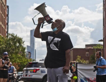 Sheldon David, a University City Townhomes resident of 13 years, spoke to supporters at a protest march after an attempted eviction of an encampment protesting the displacement of the townhomes' residents on August 8, 2022. (Kimberly Paynter/WHYY)