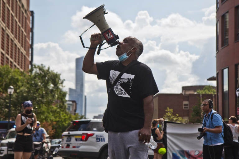 Sheldon David, a University City Townhomes resident of 13 years, spoke to supporters at a protest march after an attempted eviction of an encampment protesting the displacement of the townhomes' residents on August 8, 2022. (Kimberly Paynter/WHYY)