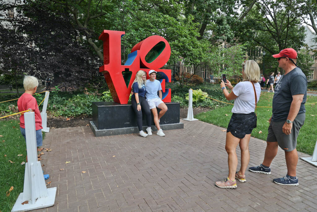 Megan DeWindt takes a photo of her son, Will Goelz, and his sister on the University of Pennsylvania's campus