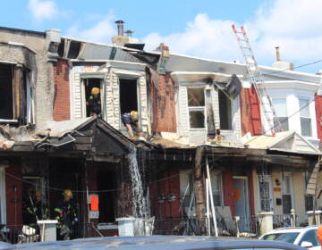 Philadelphia Fire Department putting out a fire on N. 59th St. in West Philly on August 2, 2022. (Cory Sharber/WHYY)