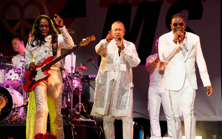 From left, Verdine White, Ralph Johnson and Philip Bailey of Earth, Wind & Fire perform at the Race to Erase MS drive-in event at the Rose Bowl, Friday, June 4, 2021, in Pasadena, Calif. (AP Photo/Chris Pizzello)