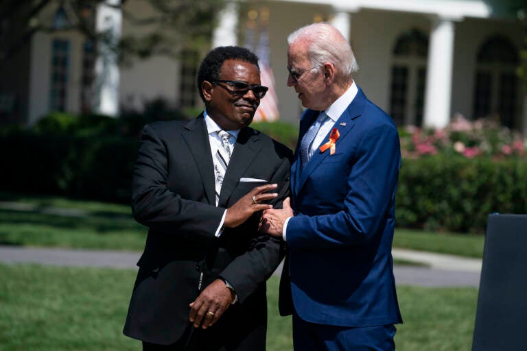 President Joe Biden talks with Garnell Whitfield Jr.