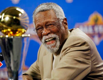 NBA great Bill Russell reacts at a news conference as he learns the most valuable player award for the NBA basketball championships has been renamed the Bill Russell NBA Finals Most Valuable Player Award, Feb. 14, 2009, in Phoenix. Russell has died at age 88. (AP Photo/Matt York)