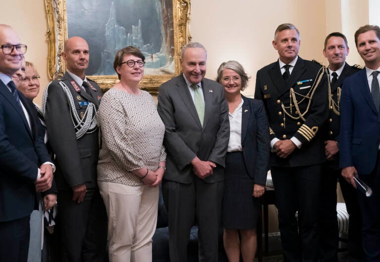 Senate Majority Leader Chuck Schumer, D-N.Y. (center) is flanked by Paivi Nevala, minister counselor of the Finnish Embassy (left) and Karin Olofsdotter, Sweden's ambassador to the U.S., as he welcomes diplomats just before the Senate vote to ratify NATO membership for the two nations in response to Russia's invasion of Ukraine, at the Capitol in Washington, Wednesday, Aug. 3, 2022. (AP Photo/J. Scott Applewhite)