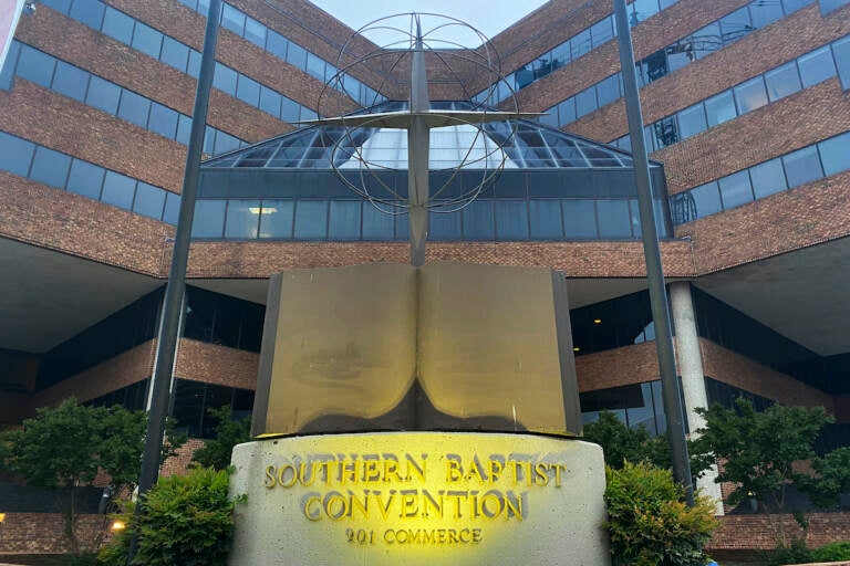 File photo: A cross and Bible sculpture stand outside the Southern Baptist Convention headquarters in Nashville, Tenn., on May 24, 2022. The Executive Committee of the Southern Baptist Convention said Friday, Aug. 12, 2022, that several of the denomination's major entities are under investigation by the U.S. Department of Justice. (AP Photo/Holly Meyer, File)