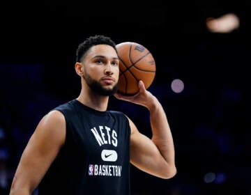 FILE - Brooklyn Nets' Ben Simmons watches practice before an NBA basketball game, Thursday, March 10, 2022, in Philadelphia. Simmons and the Philadelphia 76ers have settled the grievance he filed to recoup a portion of last season's salary, a person with knowledge of the details said Monday, Aug. 15, 2022. (AP Photo/Matt Slocum, File)