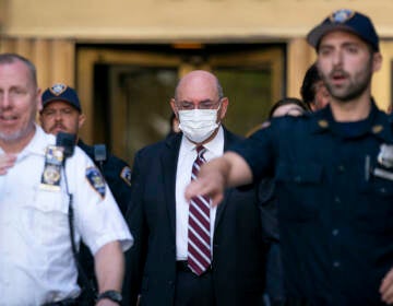 File photo: Law enforcement personnel escort the Trump Organization's former Chief Financial Officer Allen Weisselberg, center, as he departs court, Friday, Aug. 12, 2022, in New York. (AP Photo/John Minchillo, File)