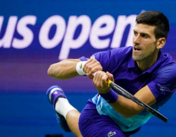 File photo: Novak Djokovic, of Serbia, returns a shot to Alexander Zverev, of Germany, during the semifinals of the U.S. Open tennis championships, Friday, Sept. 10, 2021, in New York. Djokovic will not play in the U.S. Open, as expected, because he is not vaccinated against COVID-19 and thus is not allowed to travel to the United States. Djokovic announced his withdrawal from the year’s last Grand Slam tournament on Twitter on Thursday, Aug. 25, 2022, hours before the draw for the event was revealed.  (AP Photo/John Minchillo, File)